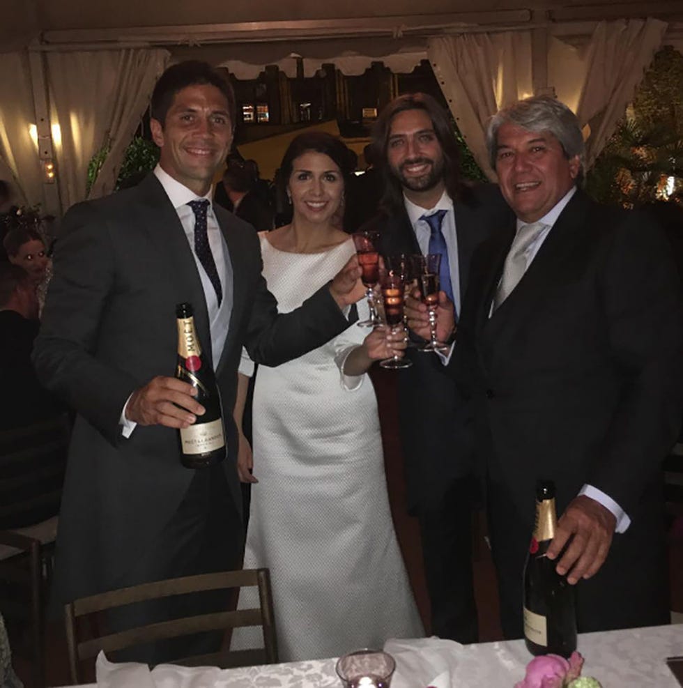 Smile, Coat, Event, Trousers, Drink, Shirt, Suit, Outerwear, Wine glass, Dress, 