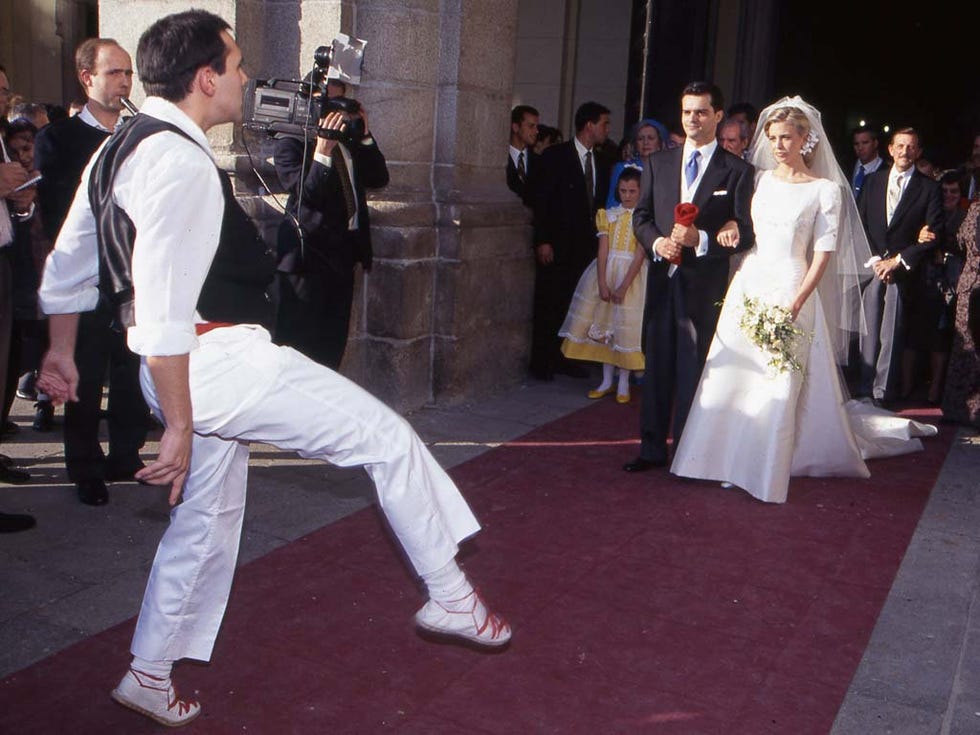 Footwear, Coat, Dress, Photograph, Suit, Flooring, Formal wear, Bridal clothing, Carpet, Gown, 