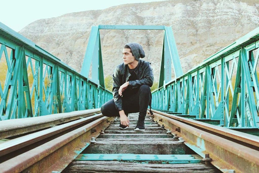 Leg, Green, Bridge, People in nature, Teal, Sitting, Travel, Aqua, Turquoise, Nonbuilding structure, Leg, Green, Bridge, People in nature, Teal, Sitting, Travel, Aqua, Turquoise, Nonbuilding structure,