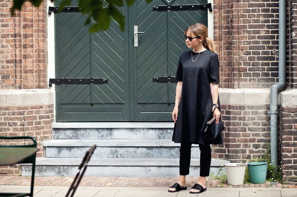 Clothing, Shoulder, Outerwear, Door, Brick, Style, Sunglasses, Street fashion, Fashion accessory, Bag, 