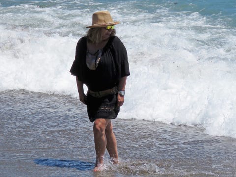 Hat, Human body, Water, Joint, Leisure, Sun hat, Summer, People in nature, Fashion accessory, Ocean, 
