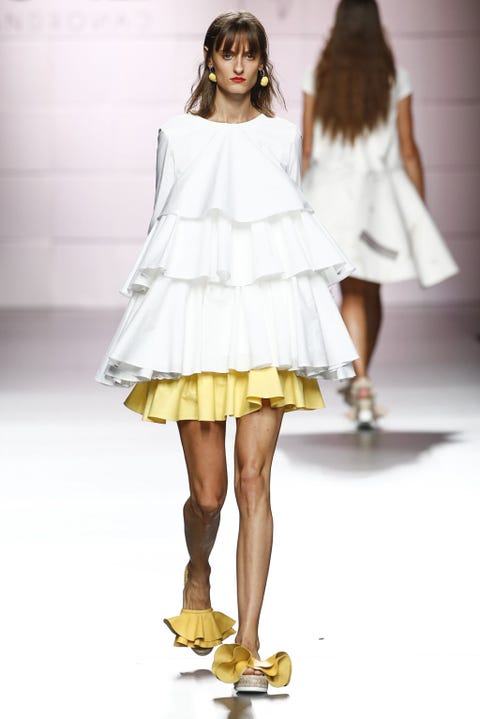 Clothing, Brown, Yellow, Sleeve, Human leg, Shoulder, Textile, Joint, Dress, One-piece garment, 