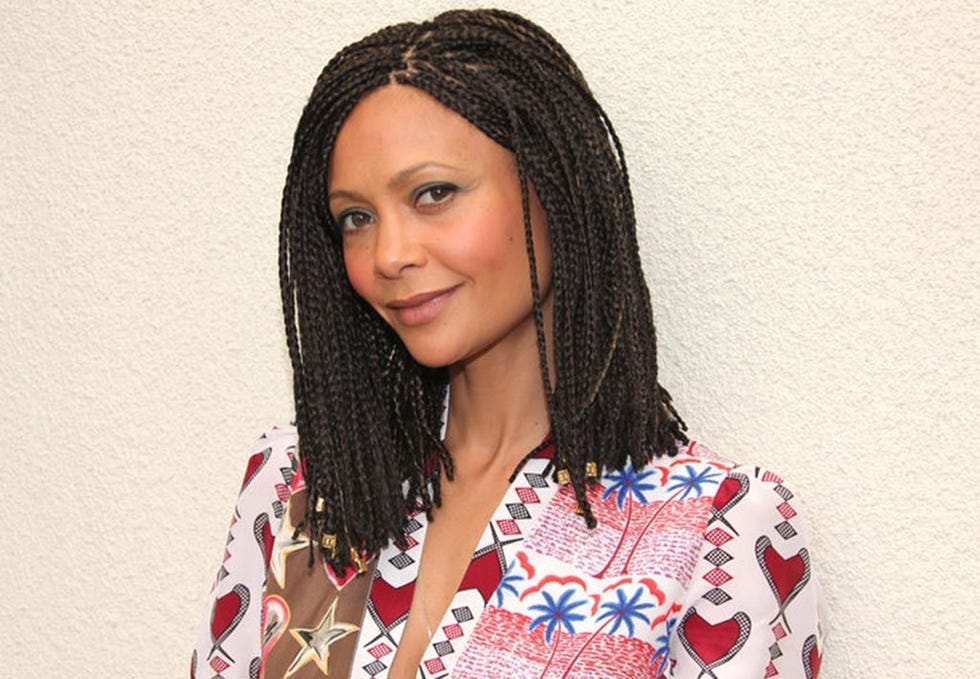 Lip, Hairstyle, Forehead, Eyebrow, Textile, Style, Black hair, Pattern, Long hair, Dreadlocks, 