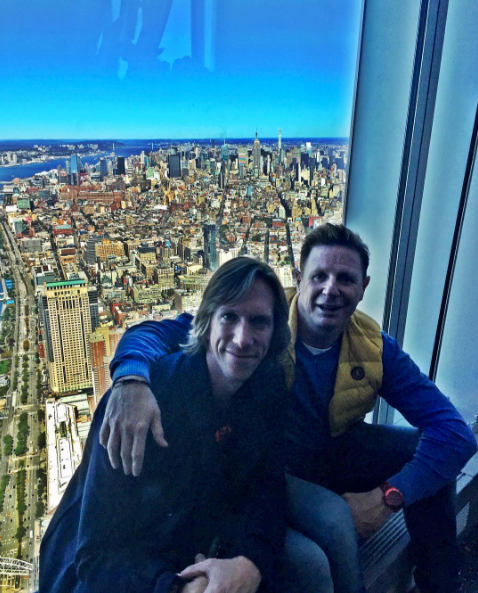 Smile, Mammal, Sitting, Travel, Cityscape, Toy, Tower block, Bird's-eye view, Selfie, 