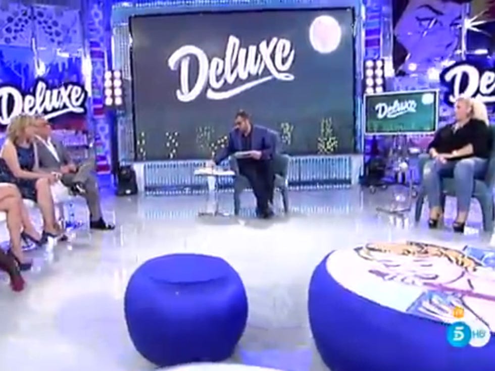 Logo, Display device, Stage, Television program, Newscaster, Television presenter, Advertising, Electric blue, Majorelle blue, Cobalt blue, 