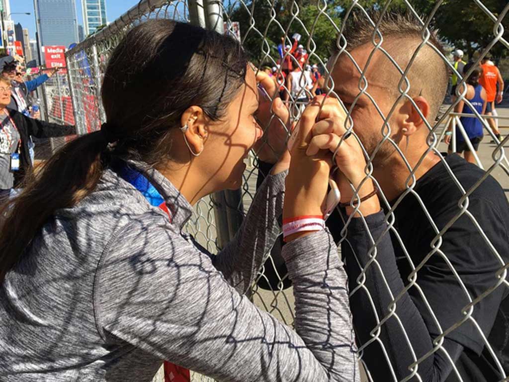Hairstyle, Mammal, Sharing, World, Black hair, Ponytail, Long hair, Wire fencing, Chain-link fencing, Bracelet, 