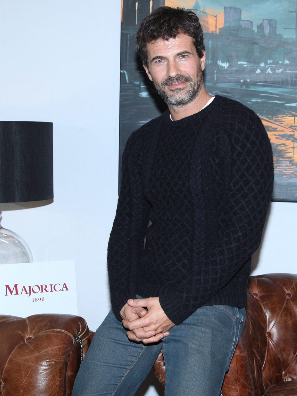 Mouth, Brown, Trousers, Denim, Facial hair, Jeans, Textile, Sitting, Beard, Moustache, 