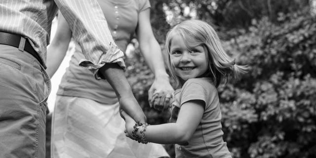 adoption girl with parents adopted