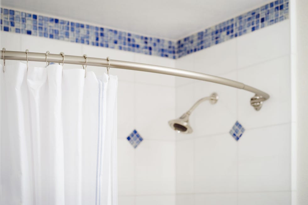 Blue, Plumbing fixture, Wall, Room, Shower head, Interior design, Shower rod, Shower curtain, Bathtub accessory, Bathroom accessory, 