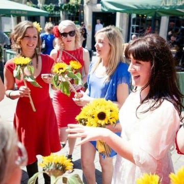 Eyewear, Smile, Yellow, Bouquet, Flower, Facial expression, Sunglasses, Dress, Petal, Cut flowers, 