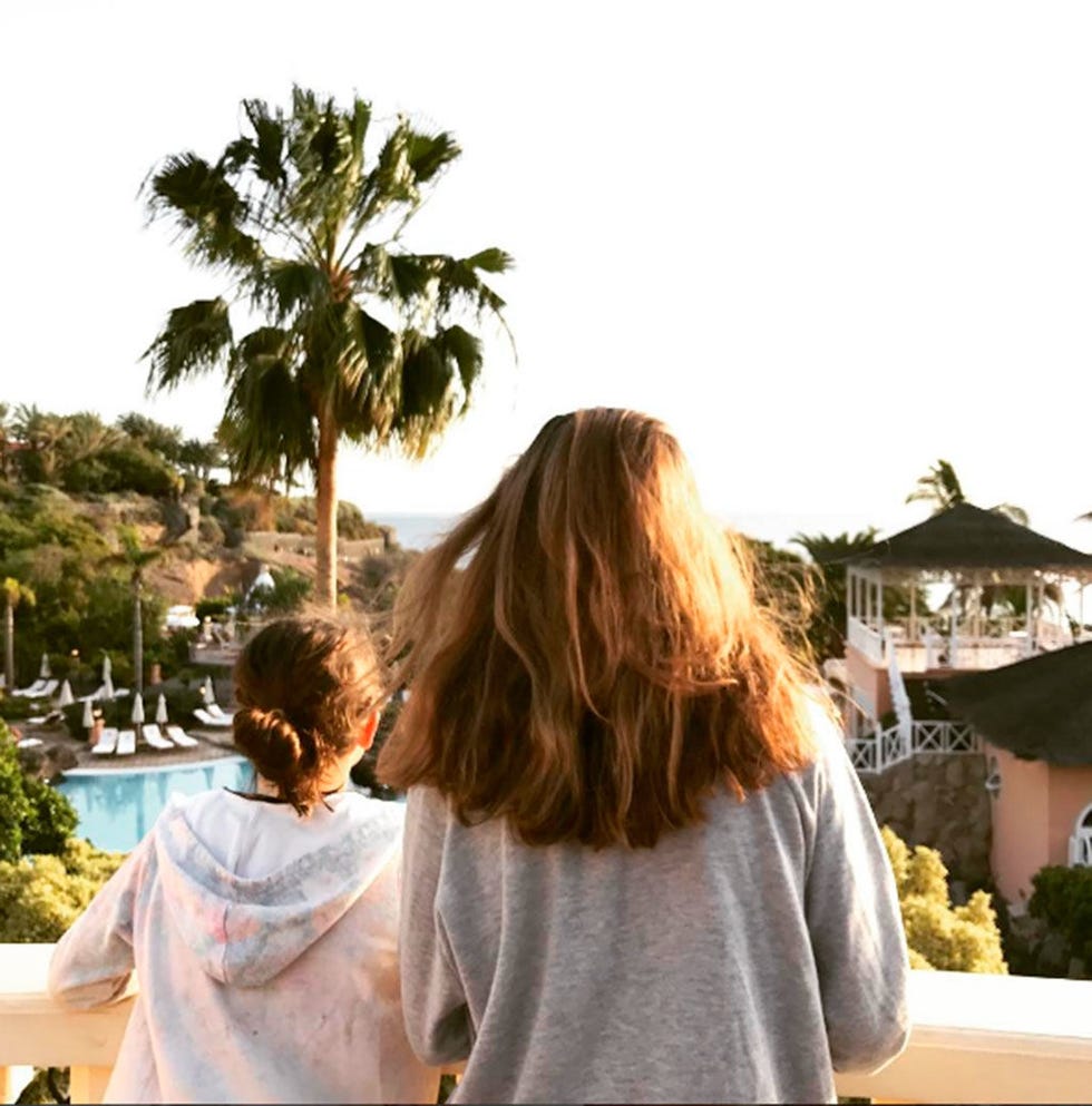 Back, Arecales, Roof, Long hair, Palm tree, Swimming pool, Resort town, Sweater, Tropics, Resort, 