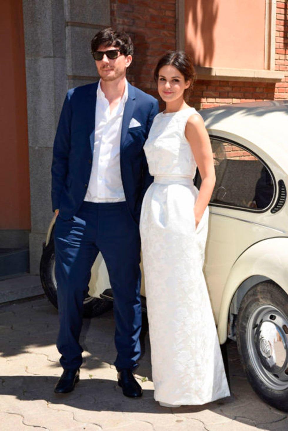 Dress, Fashion, Suit, Vehicle, Car, Shoulder, Formal wear, Luxury vehicle, Wedding dress, Gown, 
