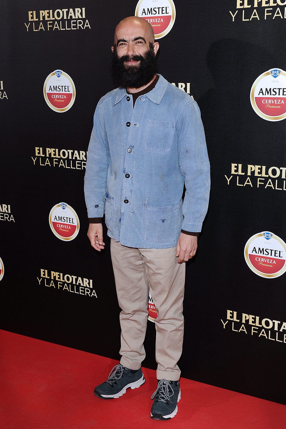 Sleeve, Shoe, Flooring, Facial hair, Dress shirt, Carpet, Beard, Logo, Premiere, Moustache, 
