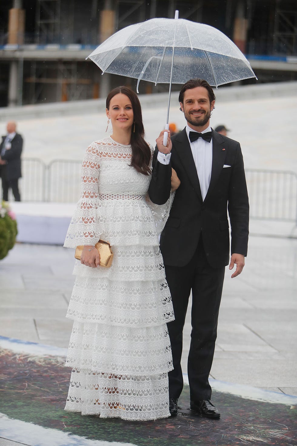 Clothing, Coat, Trousers, Dress, Shirt, Photograph, Outerwear, Standing, Umbrella, Suit, 