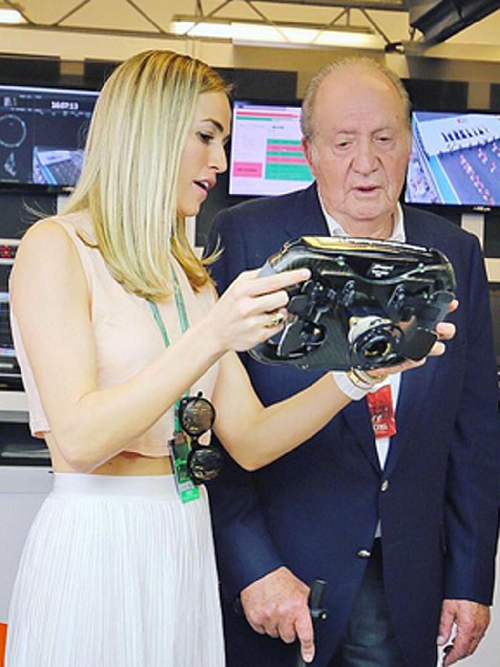 Face, Outerwear, Coat, Dress, Suit, Camera, Display device, Video camera, Television, Cocktail dress, 