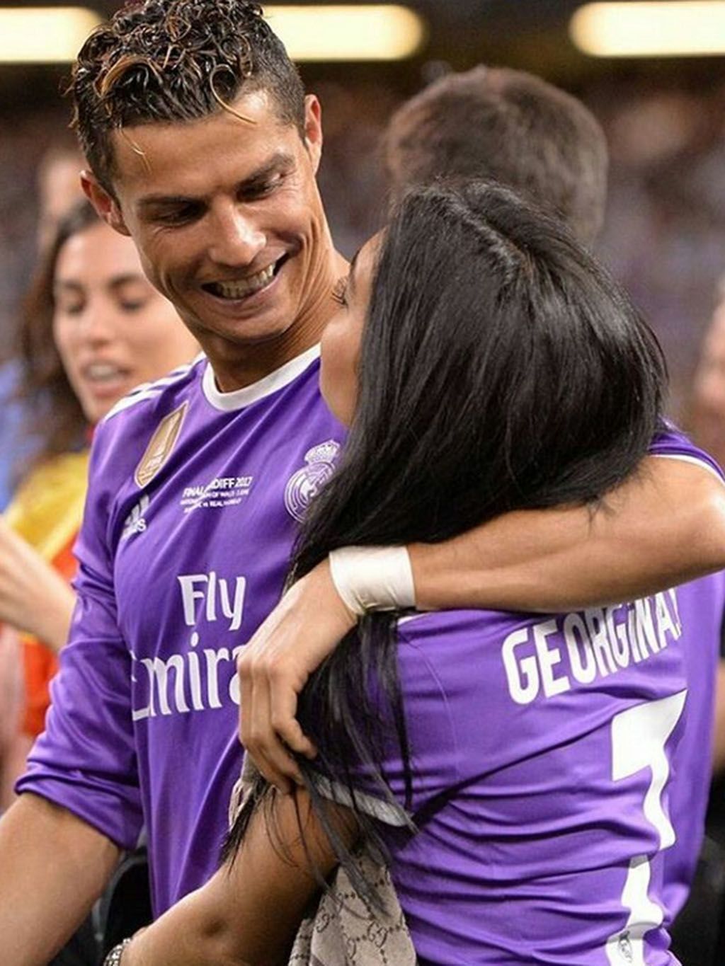 Purple, Player, Interaction, Team sport, Hug, Championship, Sports, Ball game, Tournament, Competition event, 