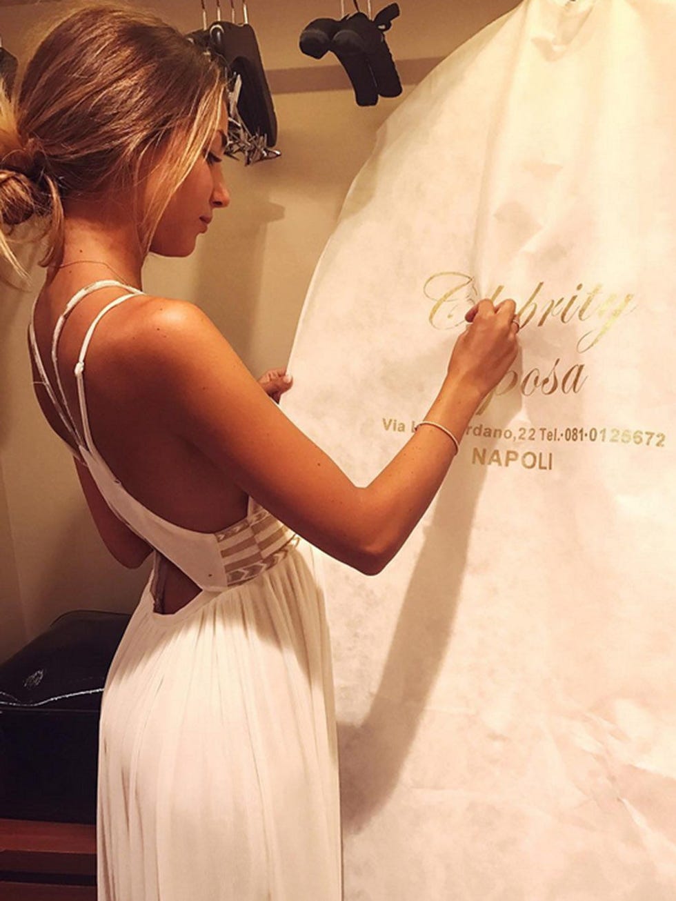 Clothing, Hairstyle, Shoulder, Dress, Textile, Joint, Bridal clothing, Bridal accessory, Gown, Wedding dress, 