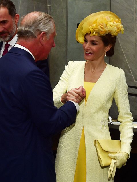 Yellow, Fashion, Interaction, Headgear, Gesture, Hat, Outerwear, Event, Suit, Smile, 