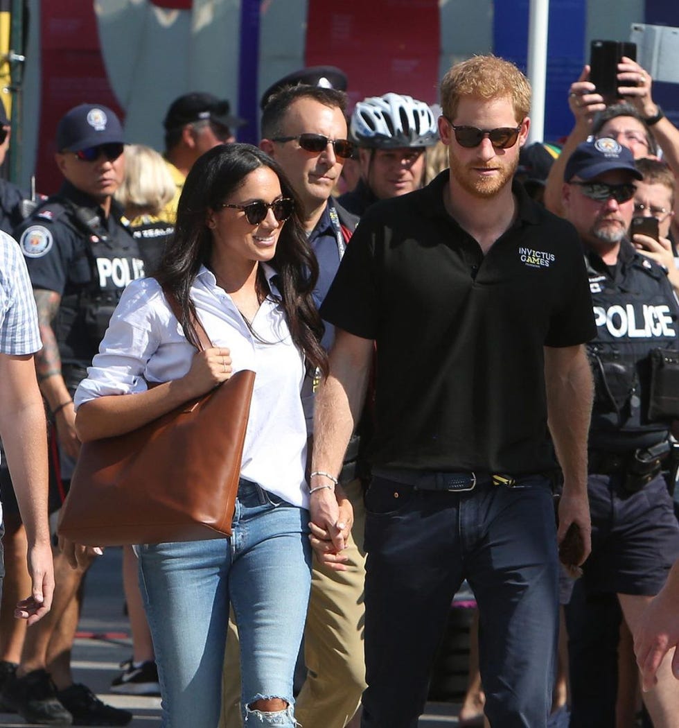 Eyewear, Jeans, Sunglasses, Crowd, Event, Police officer, Official, Textile, T-shirt, Police, 