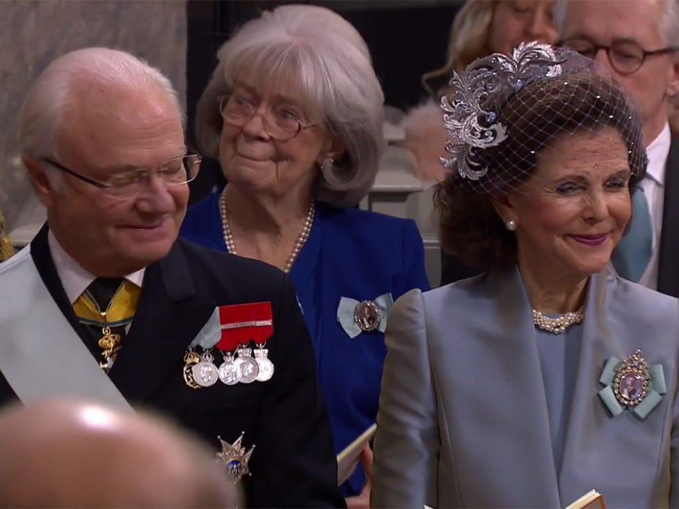 Event, Fashion accessory, Headpiece, Tiara, Hair accessory, Uniform, Jewellery, Monarchy, Official, Grandparent, 