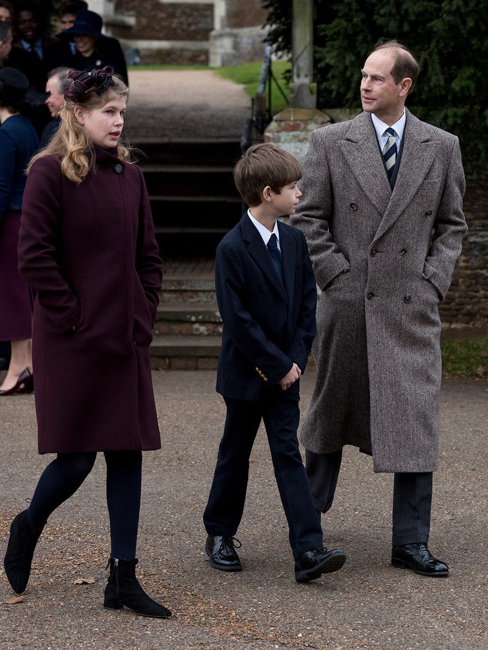 Standing, Fashion, Coat, Suit, Overcoat, Outerwear, Uniform, White-collar worker, Event, Formal wear, 