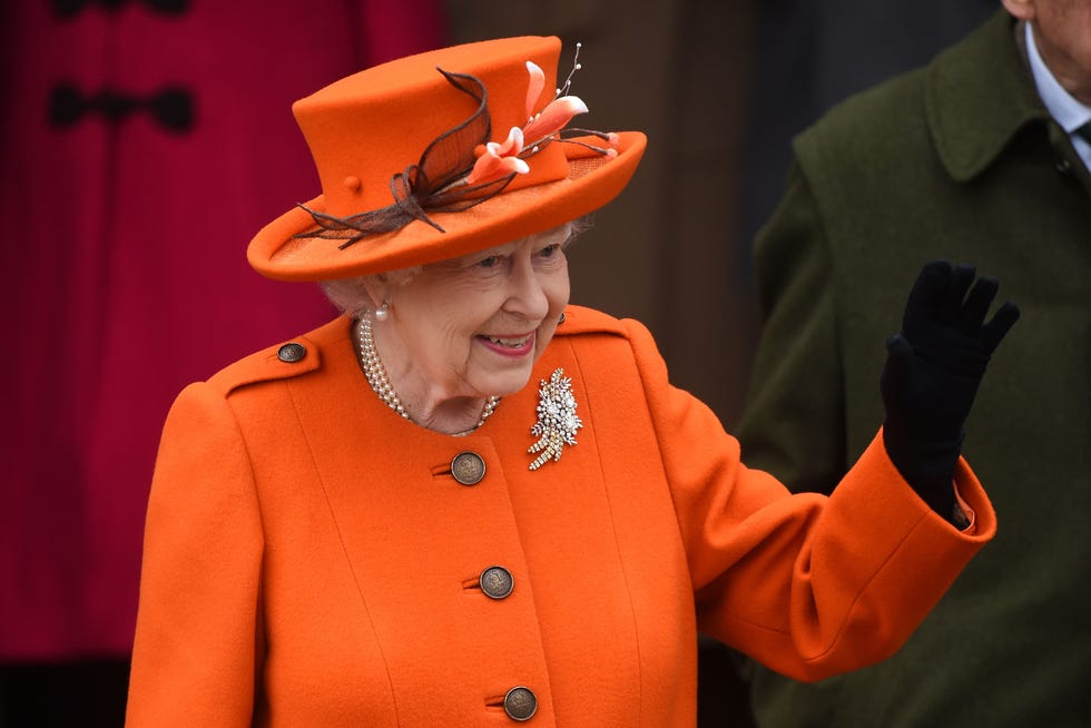 Orange, Fashion, Hat, Headgear, Suit, Fashion accessory, Performance, 