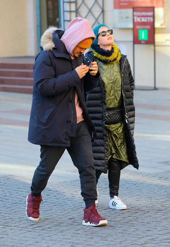 Street fashion, People, Beanie, Clothing, Fashion, Snapshot, Yellow, Footwear, Street, Interaction, 