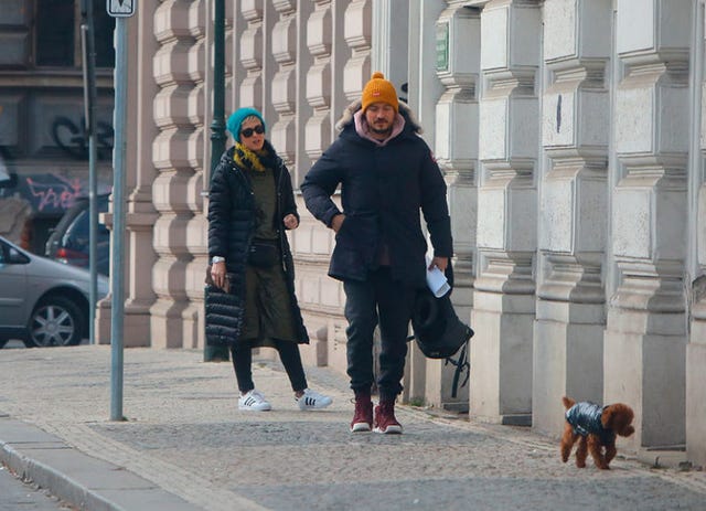 Snapshot, Pedestrian, Standing, Street, Urban area, Walking, Headgear, Tourism, Photography, Street fashion, 