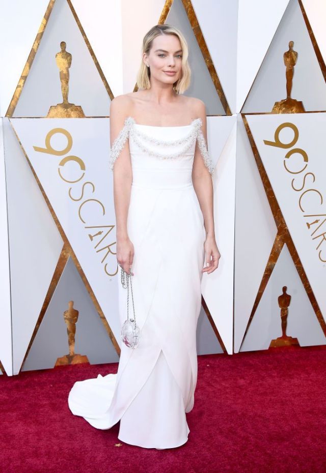 Red carpet, Dress, Carpet, Gown, Clothing, Flooring, Shoulder, Wedding dress, Bridal party dress, Hairstyle, 