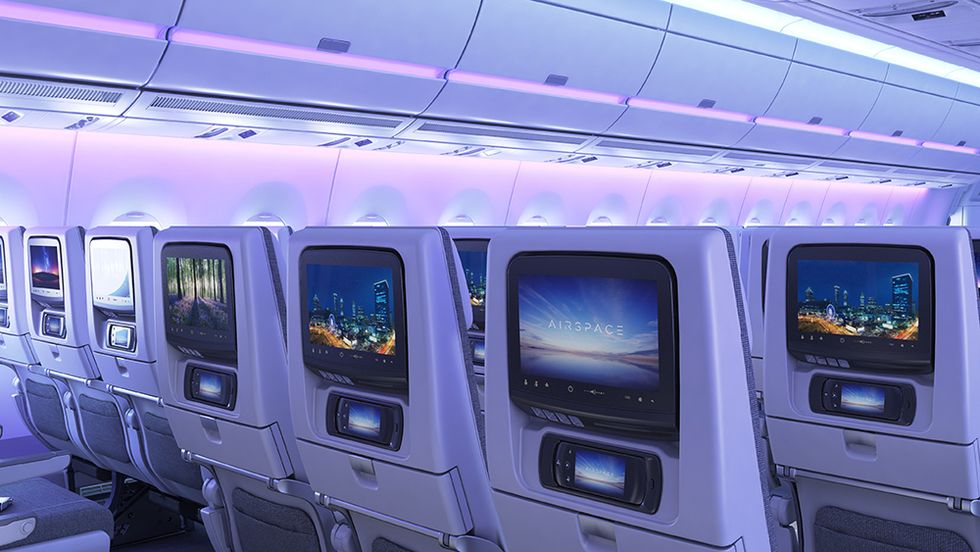 Aircraft cabin, Ceiling, Purple, Machine, Service, Space, Air travel, Aerospace engineering, Airline, Airliner, 