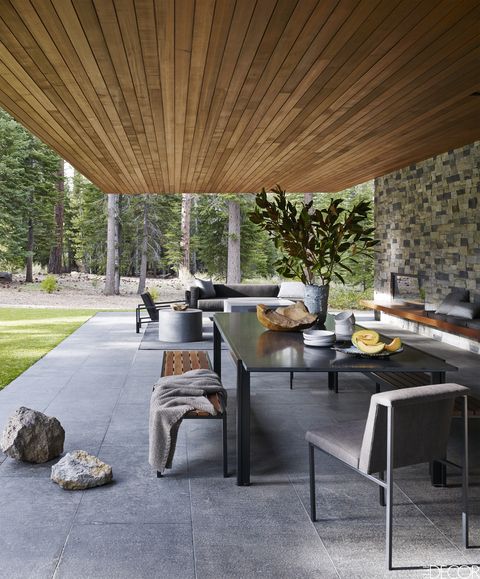 Floor, Interior design, Shade, Grey, Tints and shades, Tile, Houseplant, Stone wall, Flagstone, Outdoor structure, 