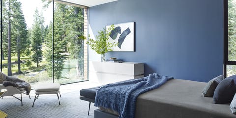 A bedroom with a blue wall | room colors to consider for your luxury home