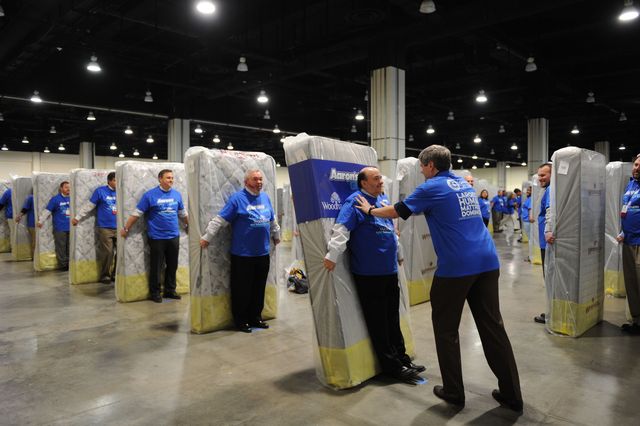 Aaron's Inc. employees earn world record for mattress human dominoes