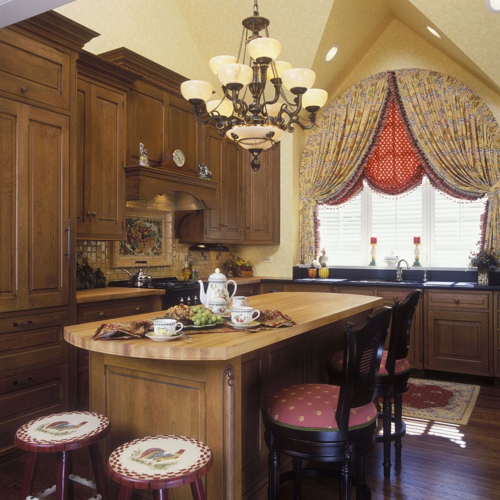 red and yellow french country kitchen