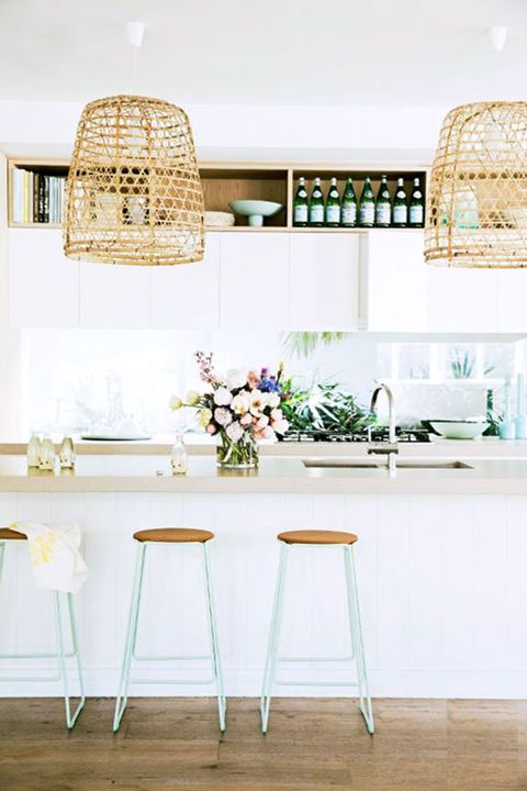 Whether it be via chair or hanging lights, wicker is summer's favorite material. 
   Via House Beautiful