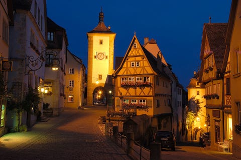 Lighting, Window, Town, Night, Neighbourhood, Street, Facade, Evening, Mixed-use, Medieval architecture, 