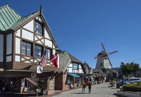 Town, Windmill, Public space, Flag, Roof, Mill, Auto part, Pedestrian, Pole, Village, 
