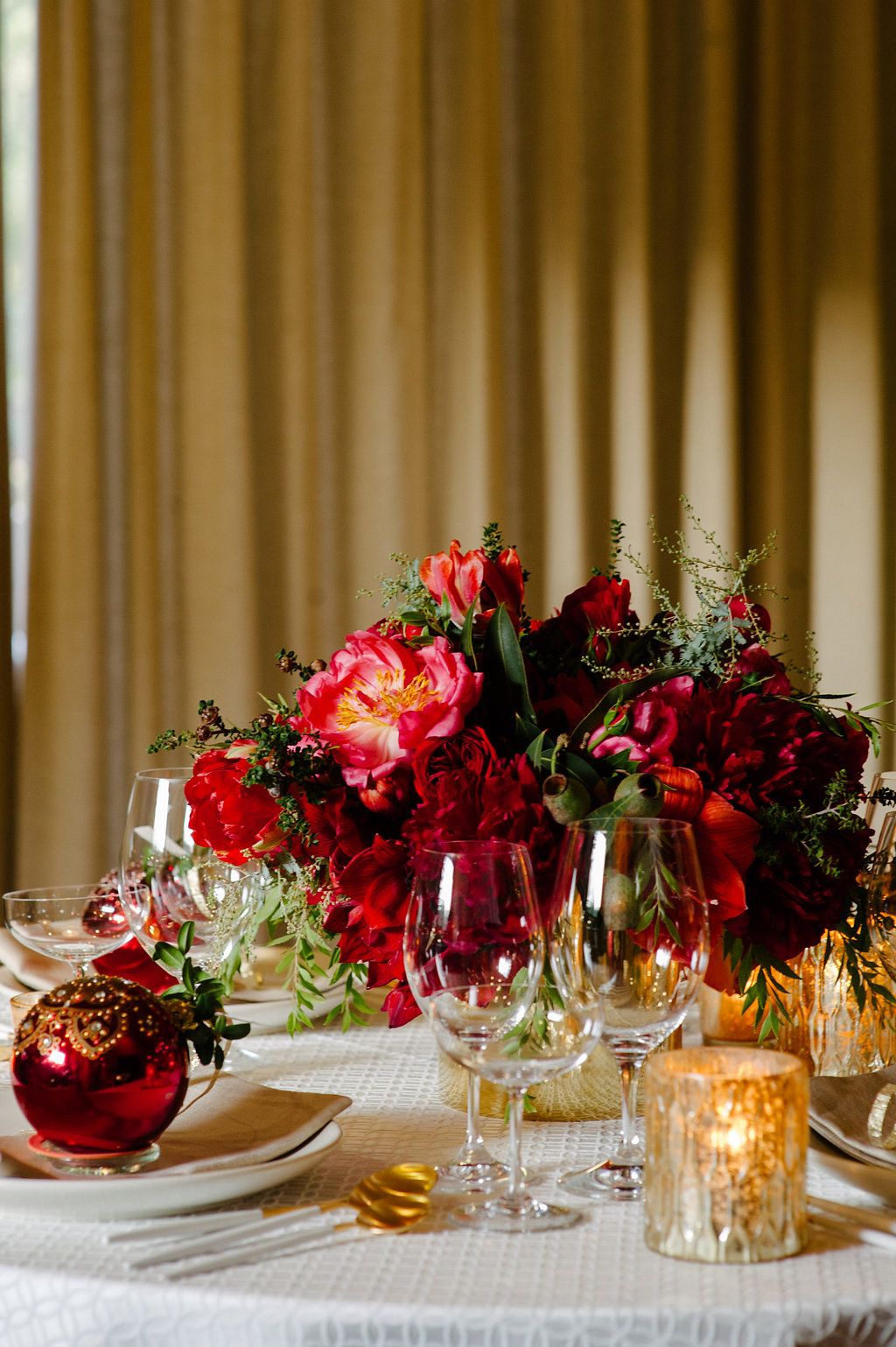 Gorgeous round red gold and white centerpieces