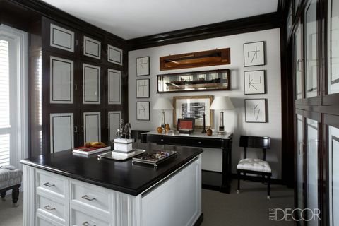 The cabinetry, ebonized-wood countertop, and fabric-covered wardrobe doors in the dressing room of <a target="_blank" href="http://www.elledecor.com/design-decorate/house-interiors/g857/luis-bustamante-madrid-apartment/">Luis Bustamante's Madrid apartment</a> are all custom made