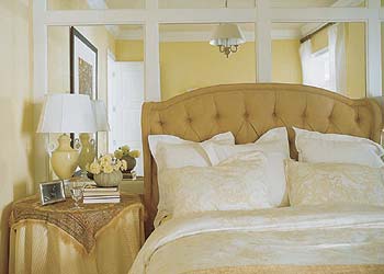 In The Master Suite At Rear Of First Floor Camel Colored Fabrics Deepen And Add Dimension To Yellow Color Scheme A Mirrored Wall Behind