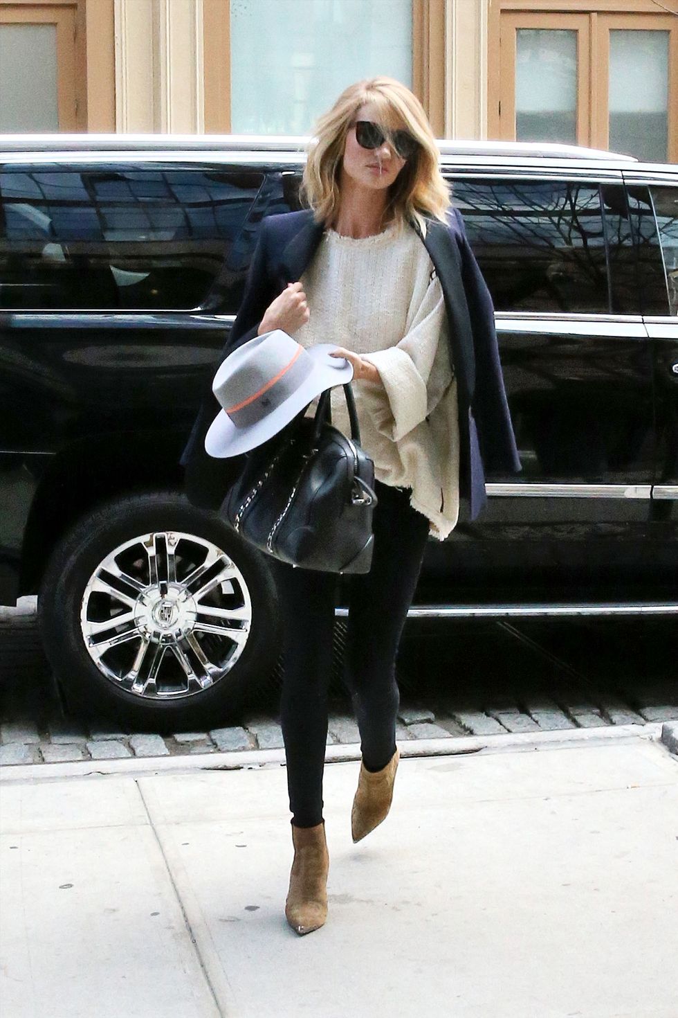 Rosie Huntington-Whiteley in black jacket and black leggings on