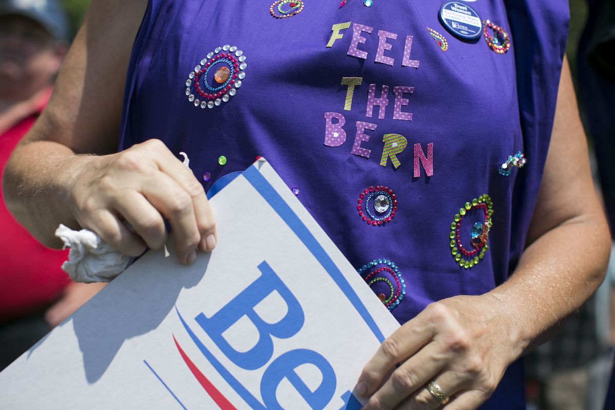 A woman listened to Bernie Sanders in Park Elridge, Iowa, in August 2015.