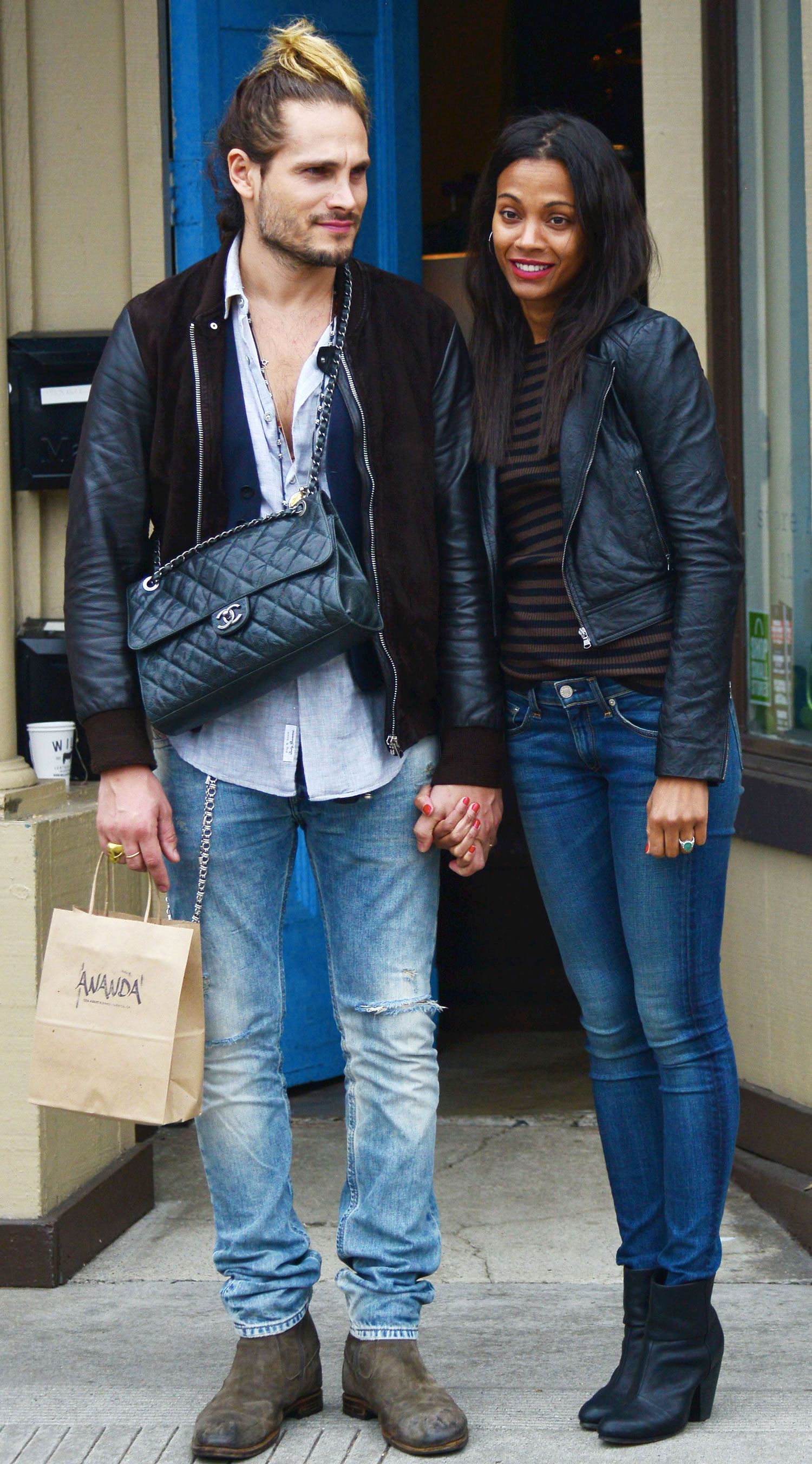 man carrying handbag