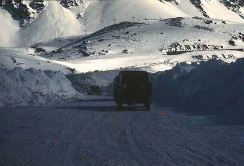 Mountainous landforms, Winter, Automotive tire, Road, Freezing, Mountain range, Slope, Highland, Snow, Automotive exterior, 