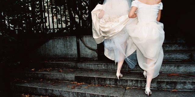 Stairs, Dress, Bridal clothing, Veil, Foot, Wedding dress, Bridal accessory, Flash photography, Gown, Embellishment, 