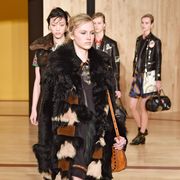 Fashion, Jacket, Black hair, Fur, Luggage and bags, Bag, Fur clothing, Boot, Leather, Costume, 