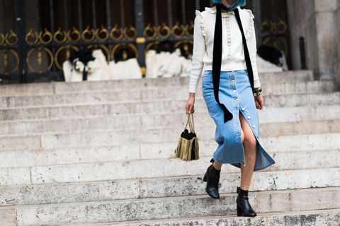 <p>A Victorian-inspired blouse worn with denim is an unexpected, but awesome combination for spring. DIY a slit on bottom by undoing a few of the buttons on your skirt. </p>