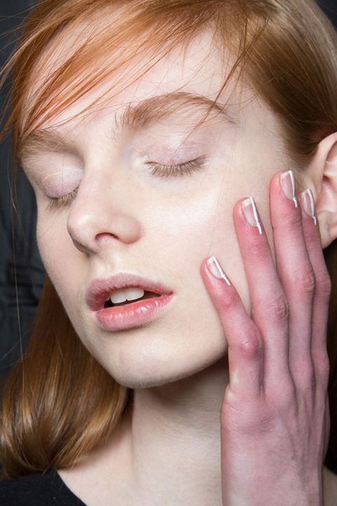 <p>"Sometimes the simplest detail is the most effective," says nail artist Keri Blair. She went minimal in her design for Delpozo, painting a thin white line that extended past the cuticle. </p>