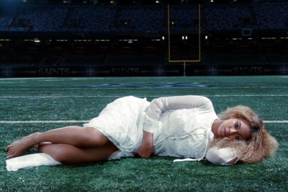 <p>"Reformation" begins with Beyoncé lying alone on a lush, green football field, her hair is soft, curly and blonde with darker roots. "For a long time we've done glamorous hair and straight styles. Here I think it's really about showing that texture and natural hair is still fashionable, still glamorous."  </p>