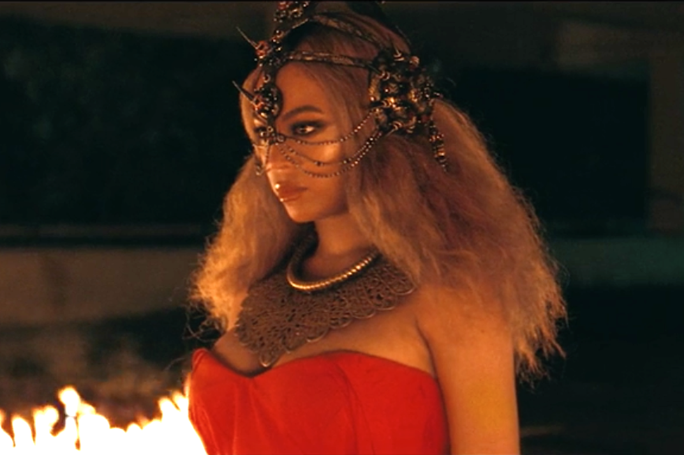 <p>At the beginning of "Emptiness," Beyoncé's hair is long, full, blonde, and textured. She is wearing an elaborate spiked headpiece, like a crown that partially covers her ears and face. The style is ferocious but contained.  </p>